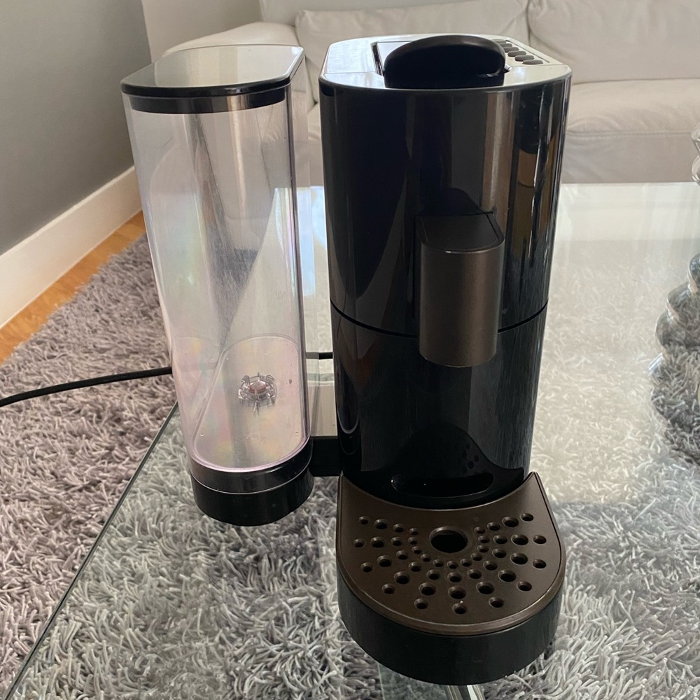 Black Starbucks Verismo coffee maker.